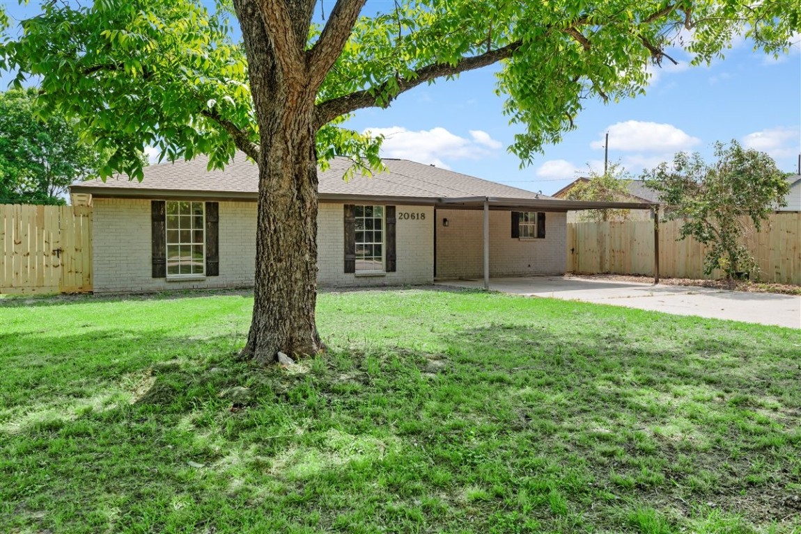 20618 Nannette Lane Spring, TX 77388 - Photo 5 of 32 front view of a house with a yard