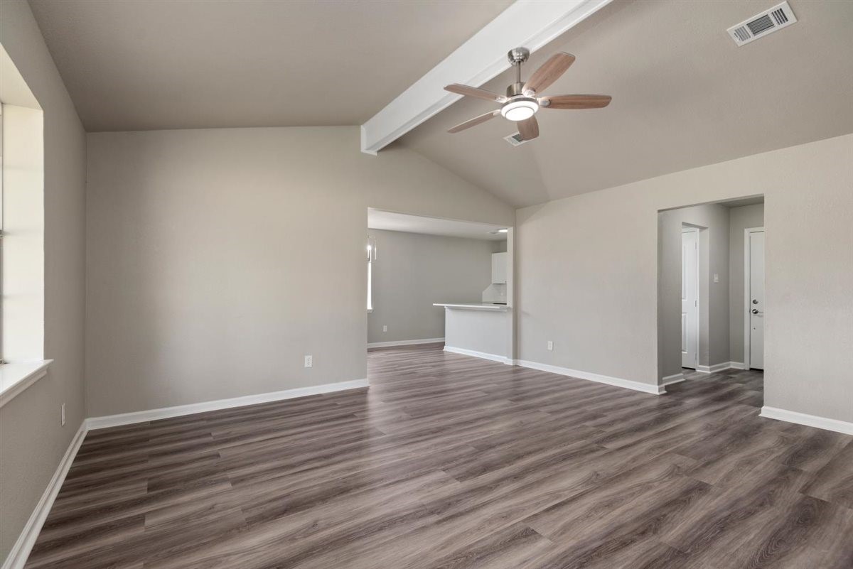 20618 Nannette Lane Spring, TX 77388 - Photo 7 of 32 a view of an empty room with wooden floor and a window