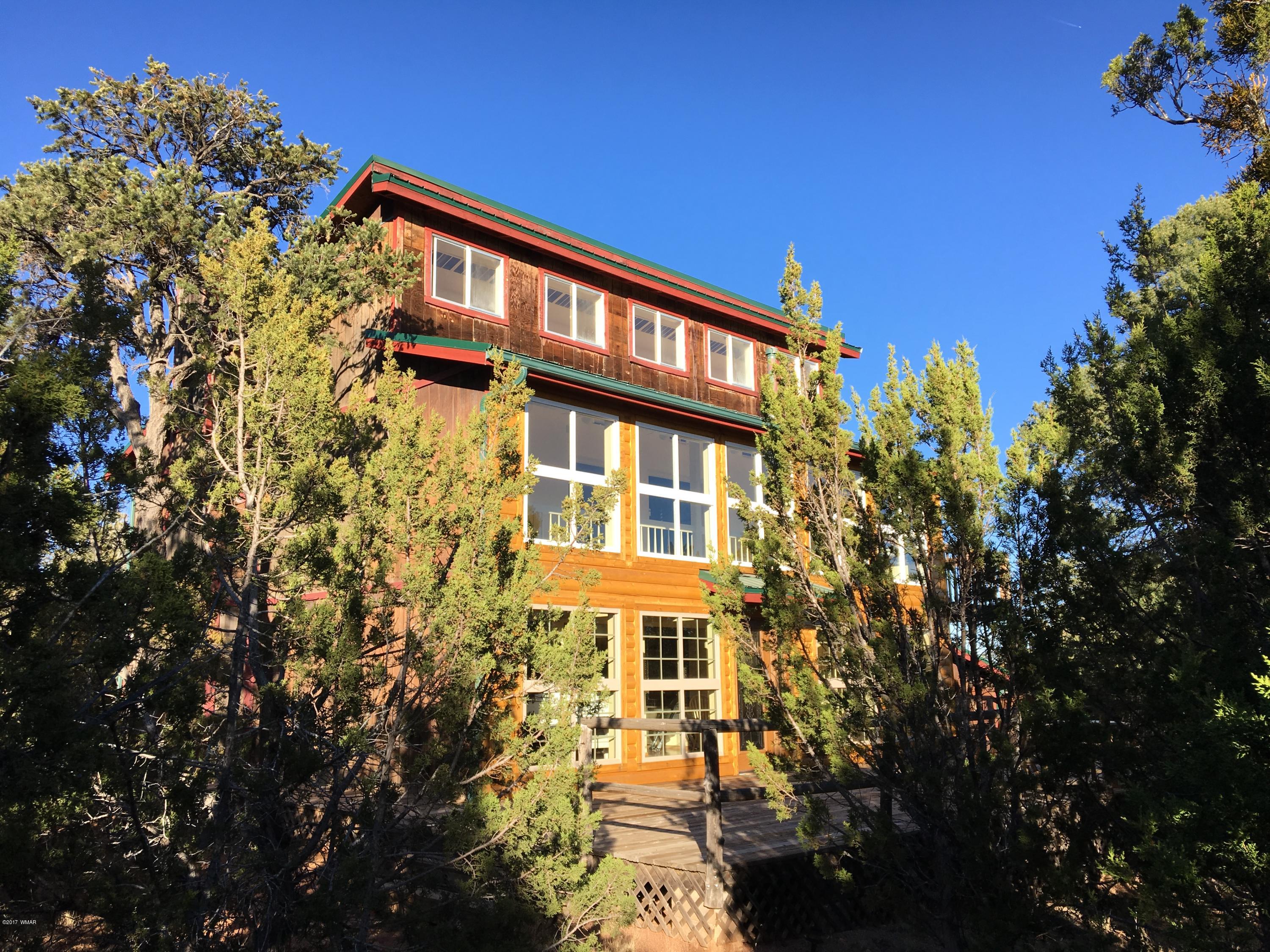 3410 Beaufeaux Road Overgaard, AZ 85933 - Photo 1 of 32 a front view of a building