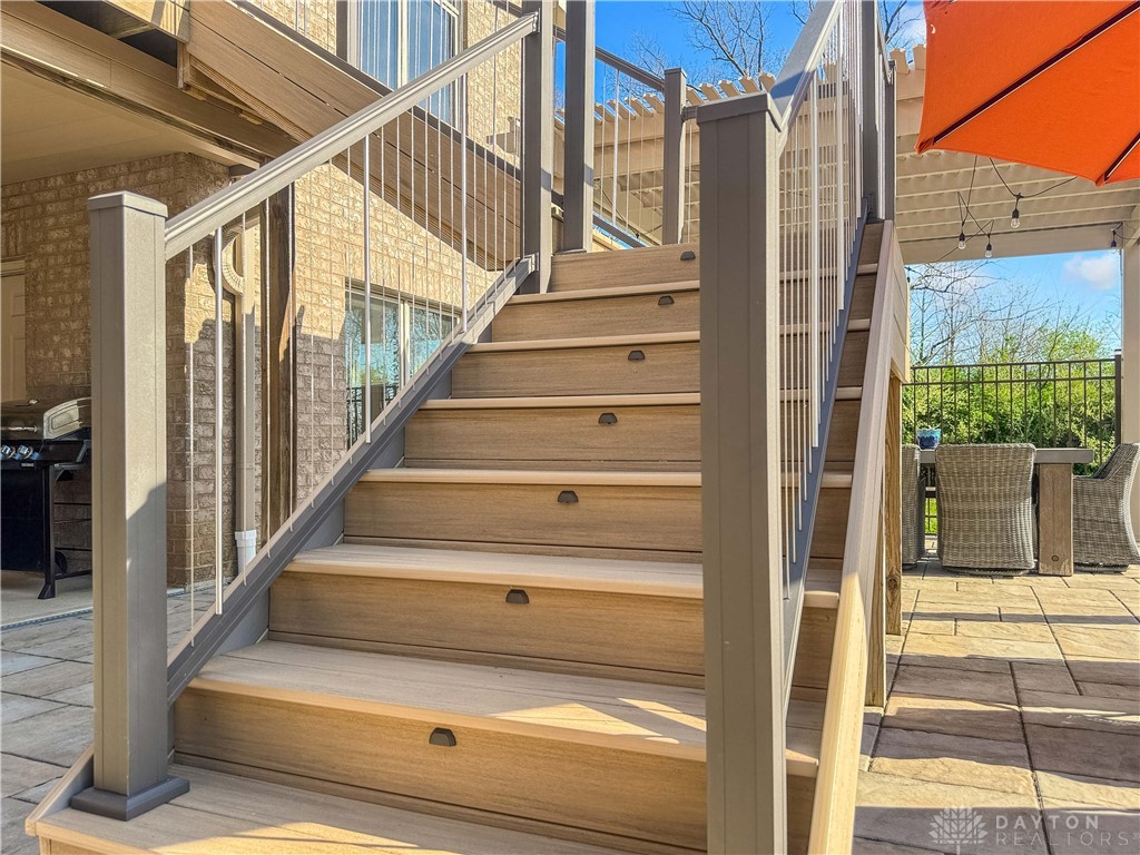 4096 Middle Urbana Road Urbana, OH 43078 - Photo 17 of 96 This outdoor staircase connects the home to a beautifully paved patio area, perfect for entertaining.