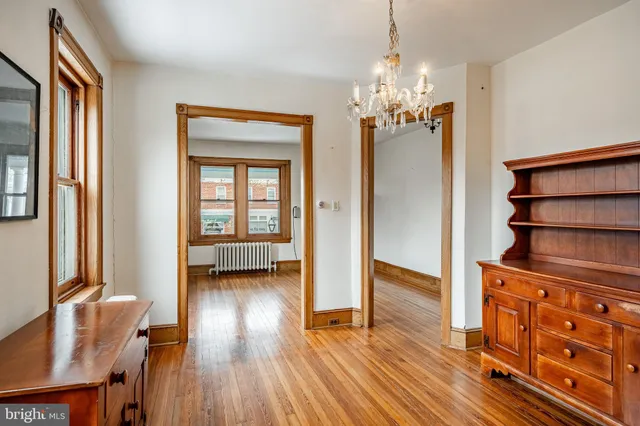 a view of a livingroom with furniture and wooden floor