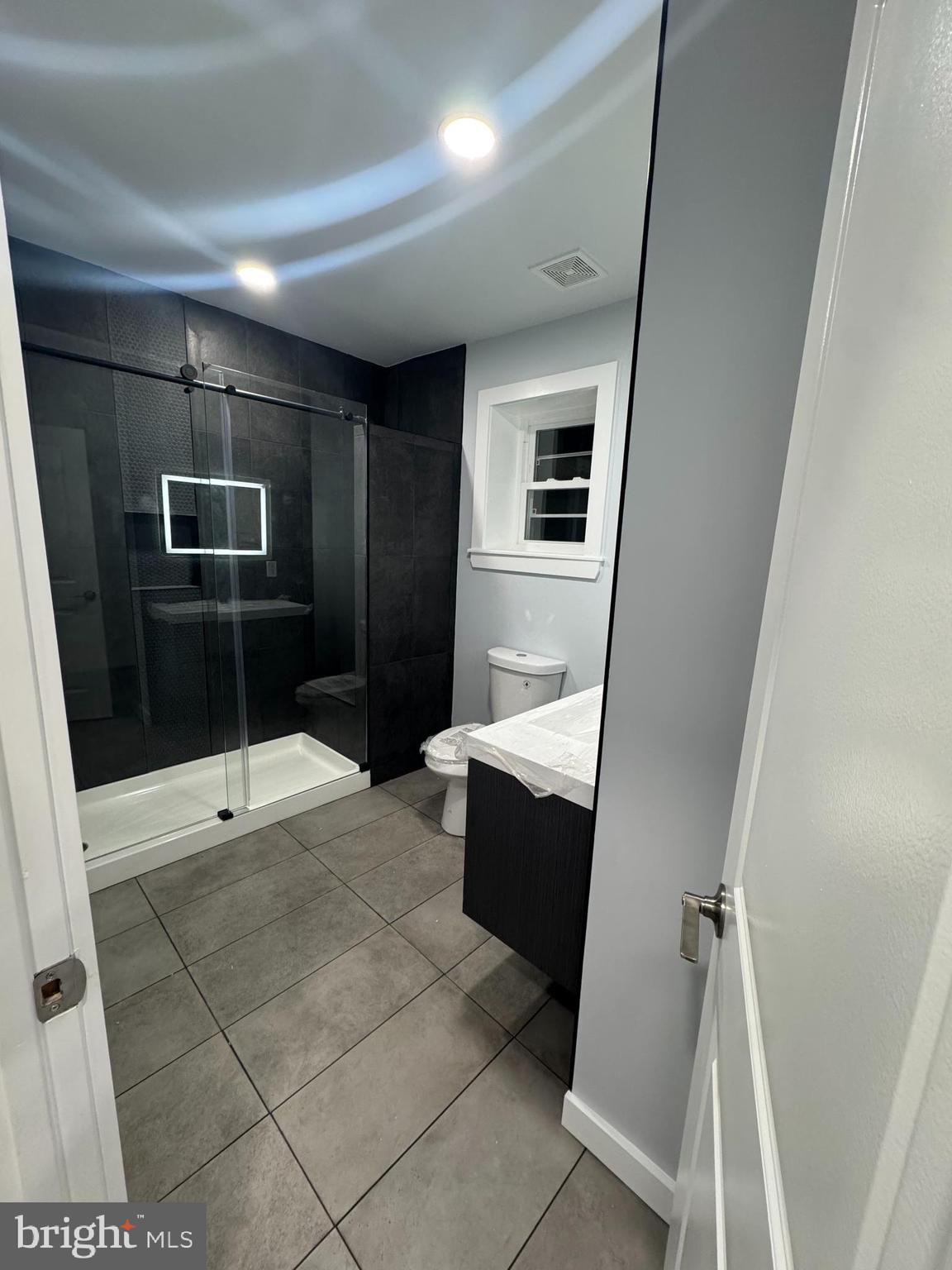 2728 North 5th Street Philadelphia, PA 19133 - Photo 3 of 7 a bathroom with a sink a toilet and shower
