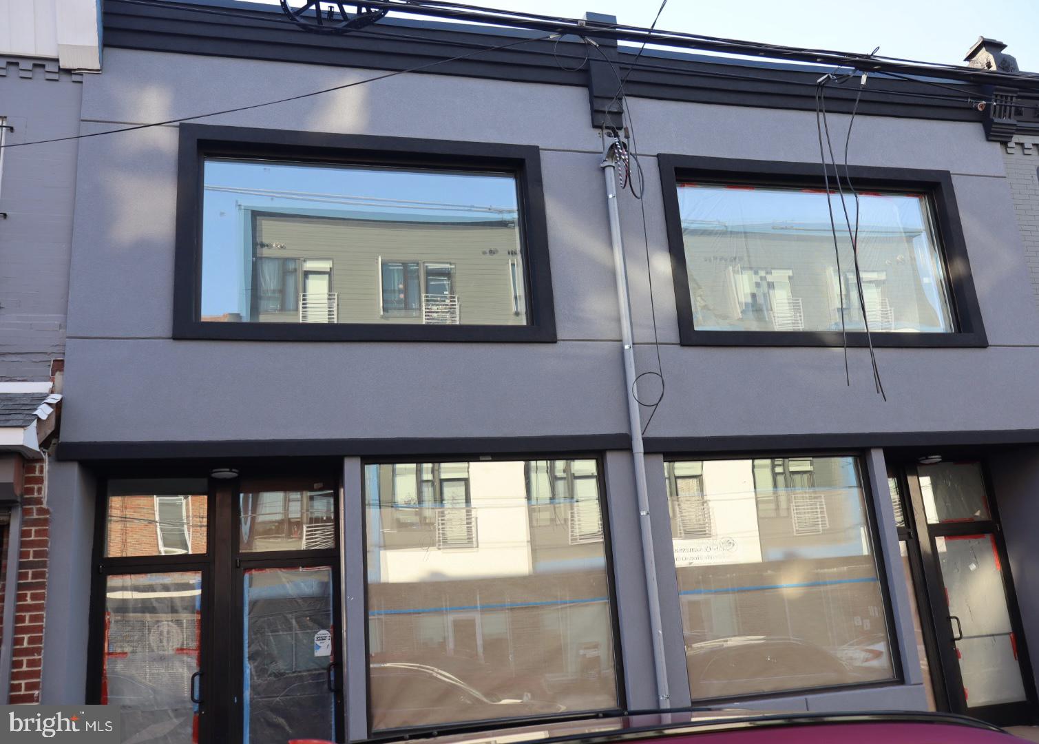 2728 North 5th Street Philadelphia, PA 19133 - Photo 6 of 7 a front view of a house with large windows