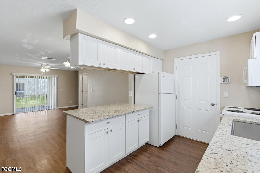 5257 Leeds Road Fort Myers, FL 33907 - Photo 11 of 30 a view of a kitchen with wooden floor