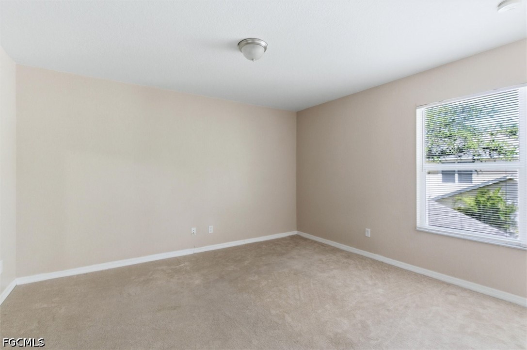 5257 Leeds Road Fort Myers, FL 33907 - Photo 14 of 30 an empty room with a window