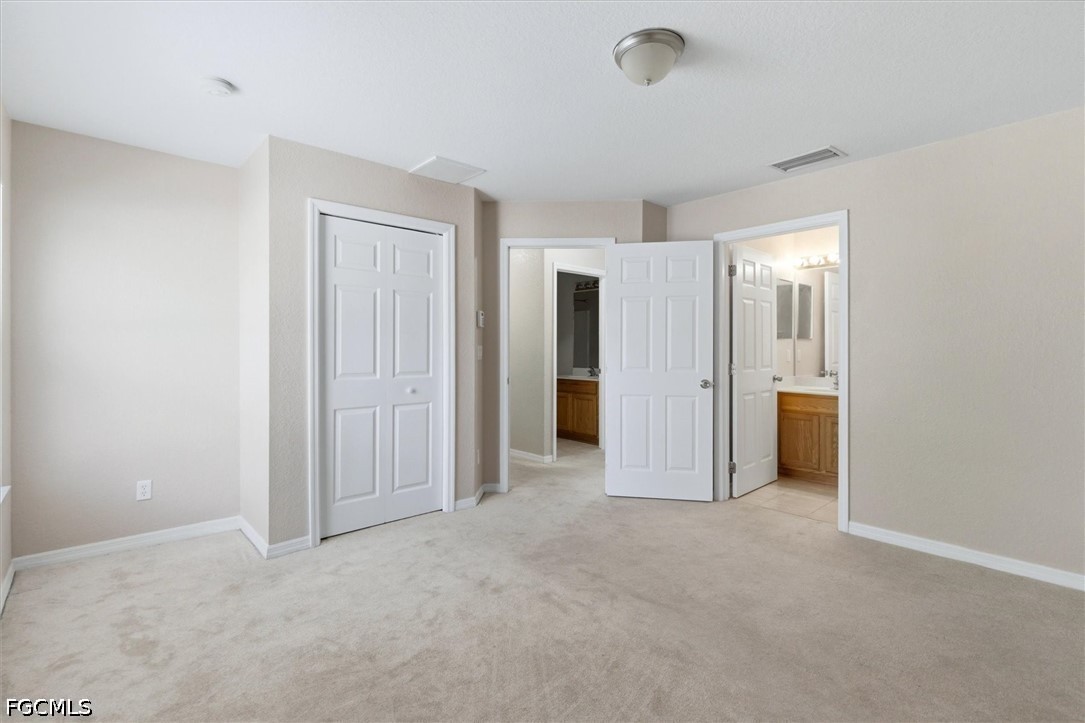 5257 Leeds Road Fort Myers, FL 33907 - Photo 15 of 30 a view of empty room with closet area