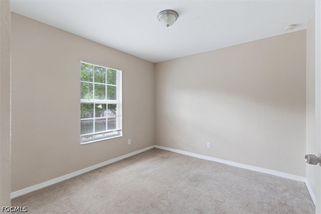 5257 Leeds Road Fort Myers, FL 33907 - Photo 19 of 30 an empty room with windows