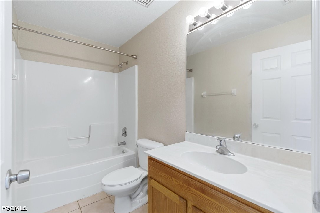5257 Leeds Road Fort Myers, FL 33907 - Photo 21 of 30 a bathroom with a sink a toilet and shower