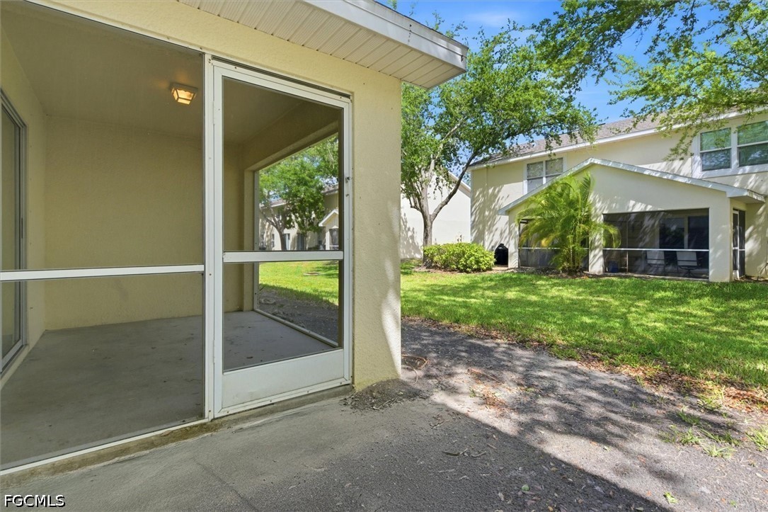 5257 Leeds Road Fort Myers, FL 33907 - Photo 27 of 30 a view of a house with big yard and large tree