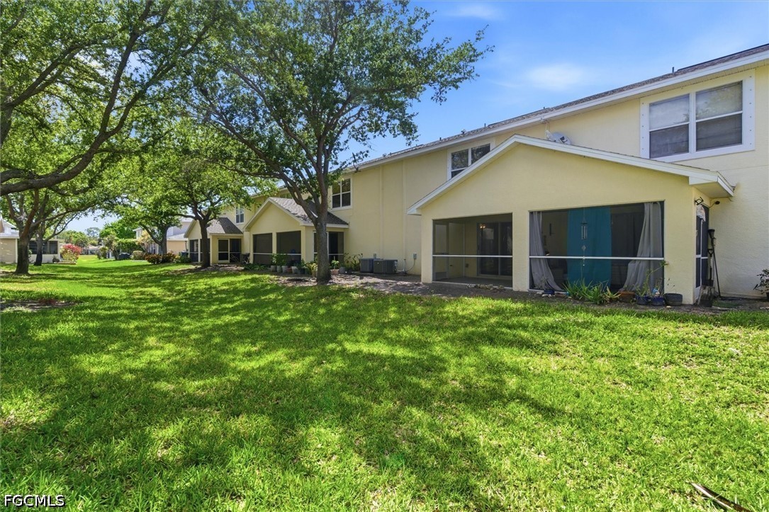 5257 Leeds Road Fort Myers, FL 33907 - Photo 29 of 30 a front view of house with a garden