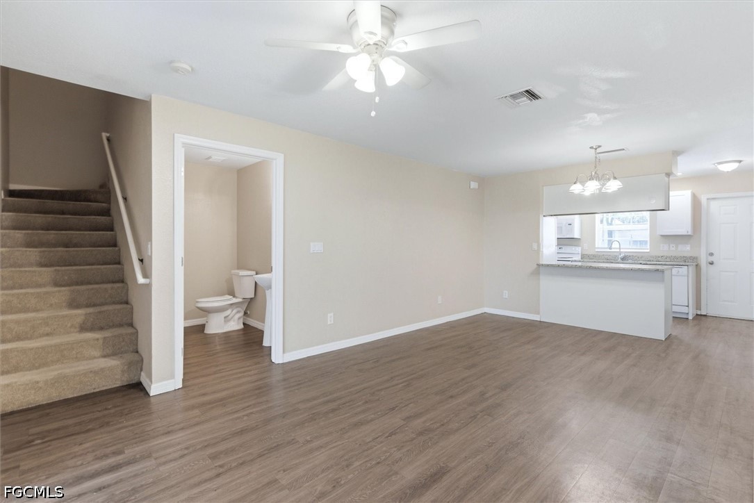 5257 Leeds Road Fort Myers, FL 33907 - Photo 6 of 30 a view of a kitchen with wooden floor and a kitchen