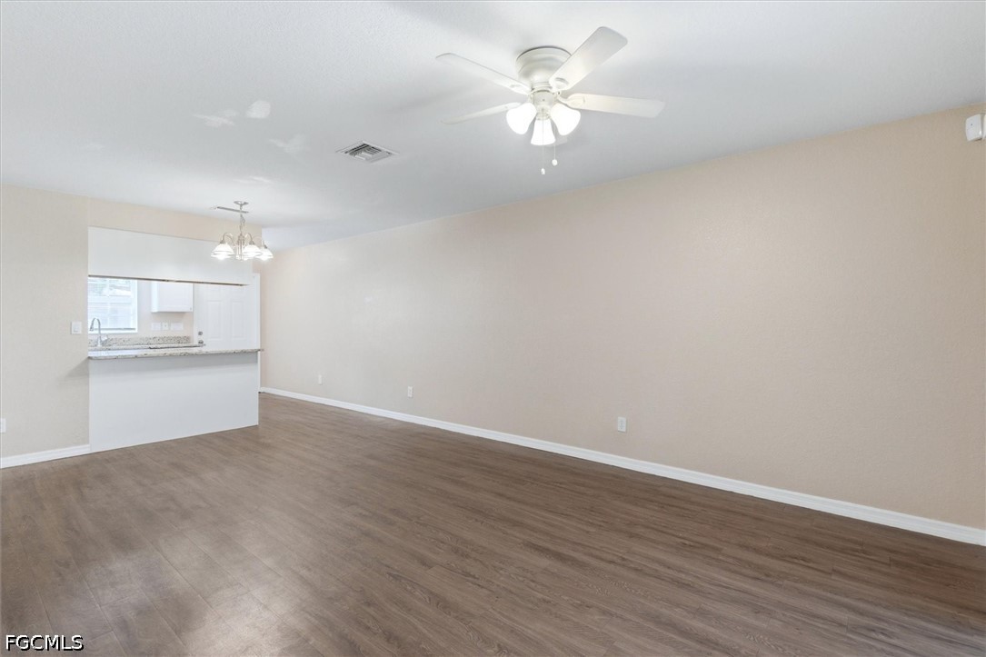 5257 Leeds Road Fort Myers, FL 33907 - Photo 7 of 30 a view of an empty room with a kitchen