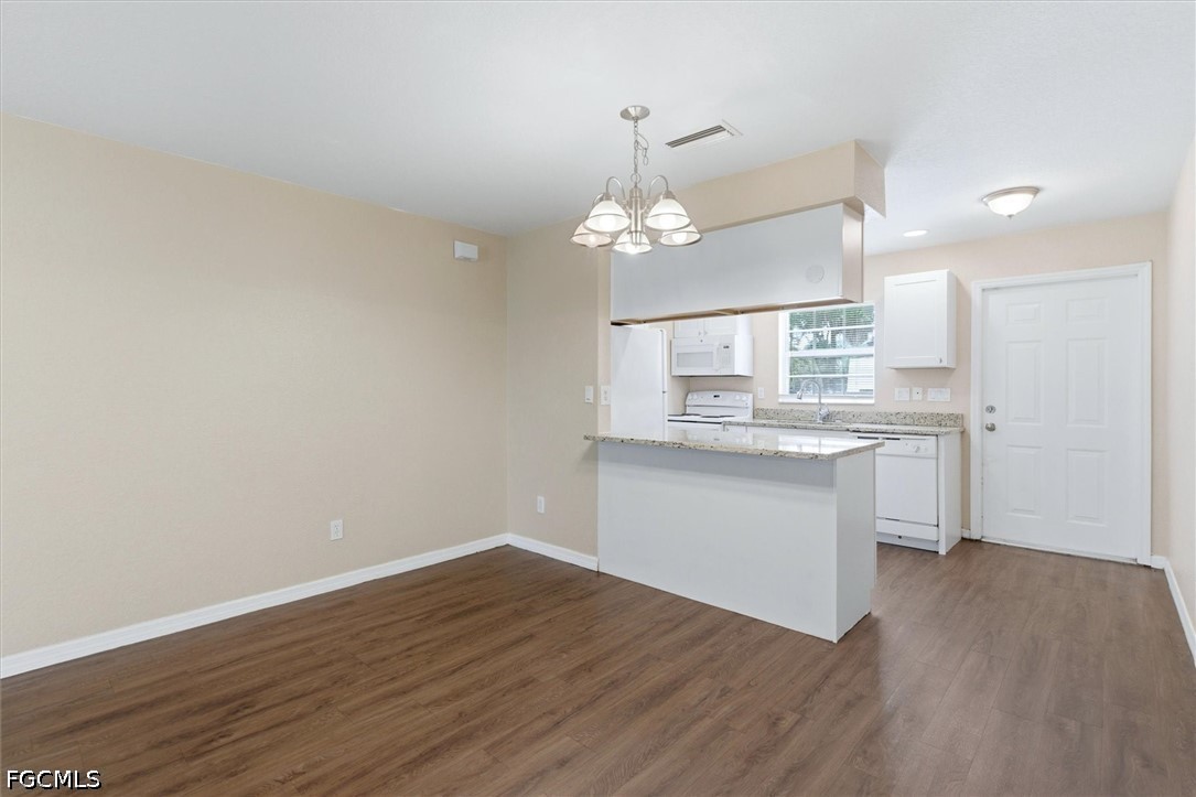 5257 Leeds Road Fort Myers, FL 33907 - Photo 9 of 30 a kitchen with a sink cabinets and wooden floor