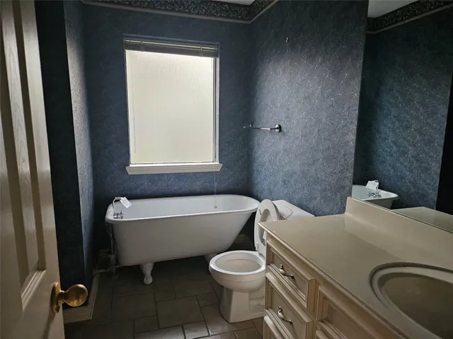 a bathroom with a sink toilet and bathtub