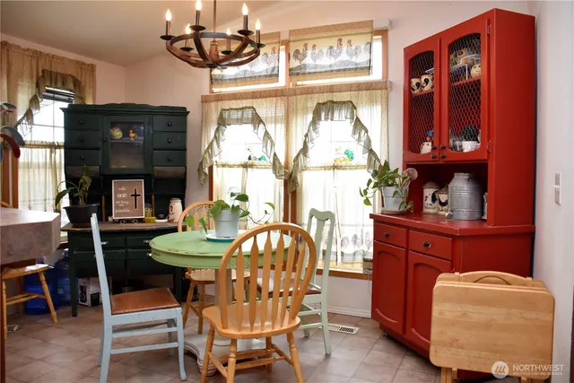 a dining room with furniture and window