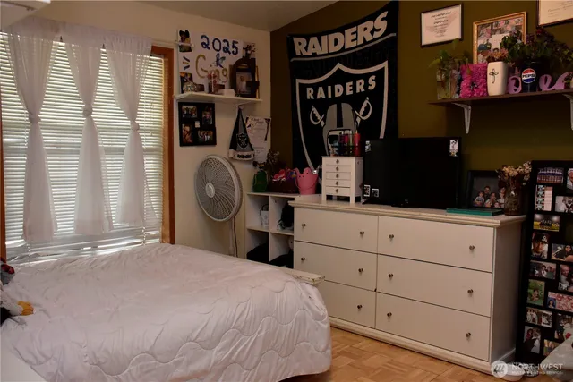 a bedroom with a bed and cabinets