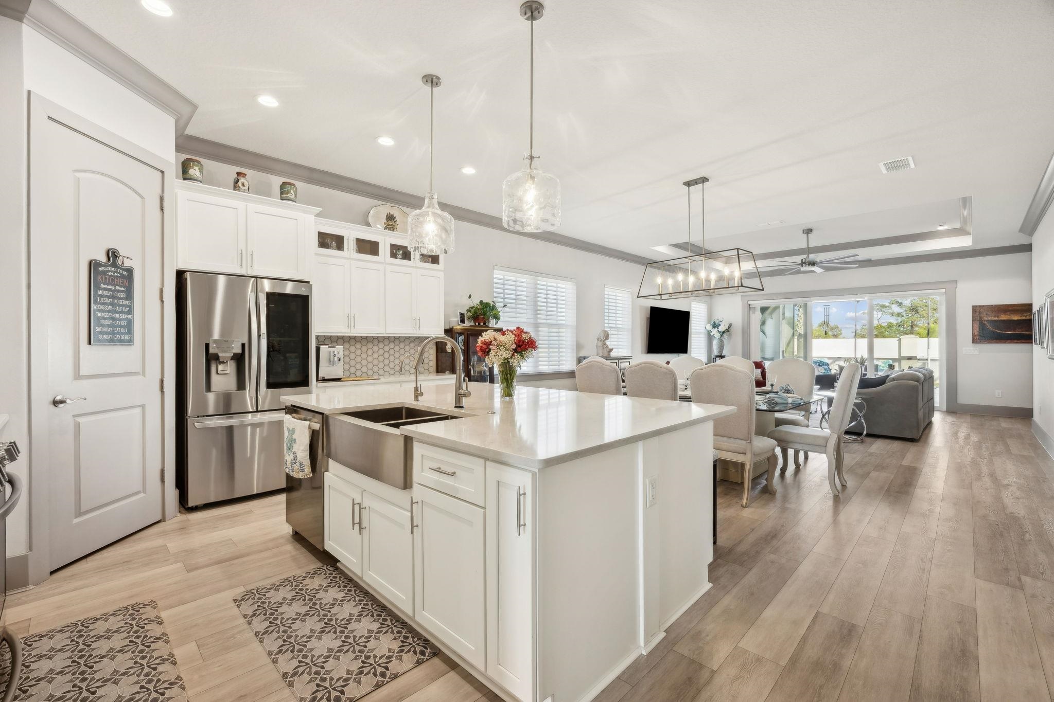 18 Rio Vista Drive Palm Coast, FL 32137 - Photo 73 of 73 a kitchen with a sink refrigerator and cabinets