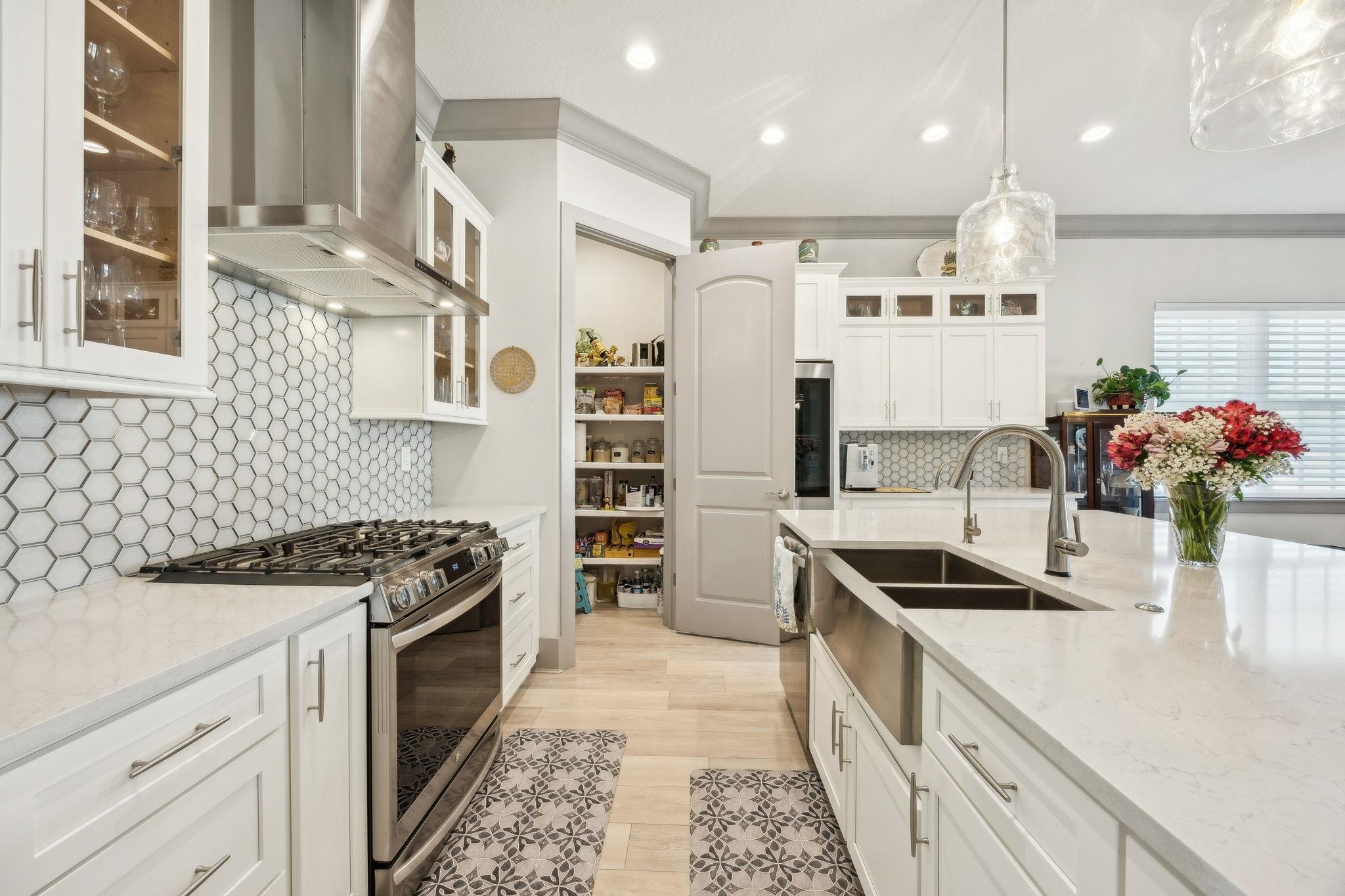 18 Rio Vista Drive Palm Coast, FL 32137 - Photo 14 of 73 a kitchen with stainless steel appliances a stove a sink and a refrigerator