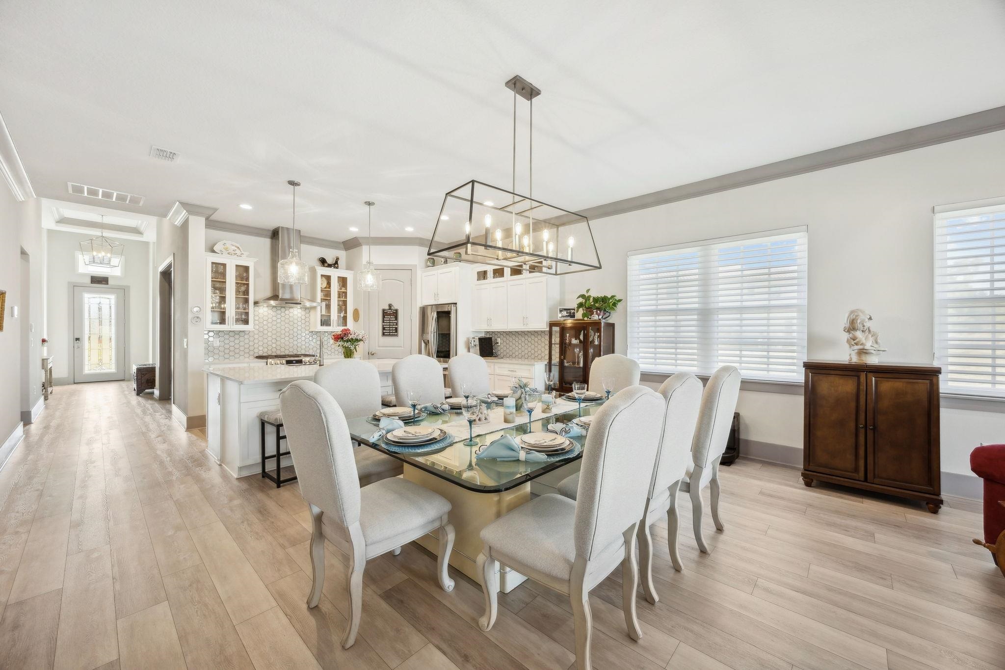 18 Rio Vista Drive Palm Coast, FL 32137 - Photo 19 of 73 a view of a dining room and livingroom with furniture wooden floor a chandelier