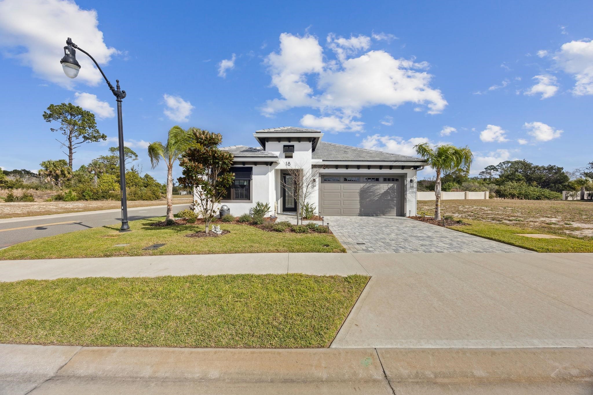 18 Rio Vista Drive Palm Coast, FL 32137 - Photo 2 of 73 a view of a house with outdoor space and swimming pool