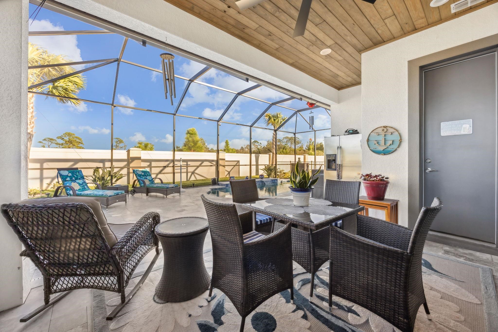 18 Rio Vista Drive Palm Coast, FL 32137 - Photo 26 of 73 a outdoor dining space with furniture and outdoor view