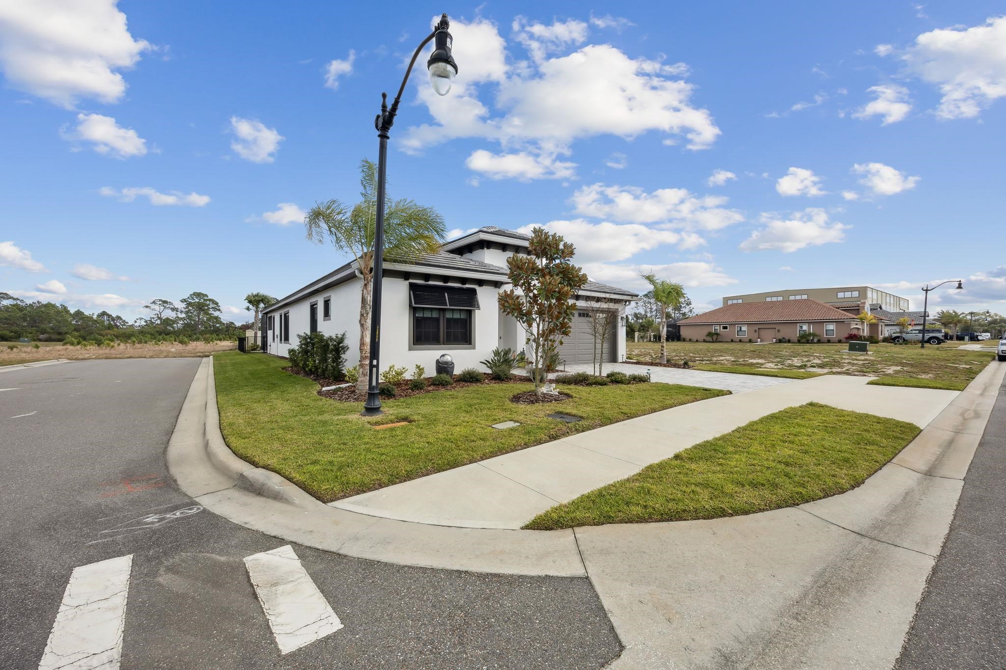 18 Rio Vista Drive Palm Coast, FL 32137 - Photo 3 of 73 a view of a swimming pool with a yard