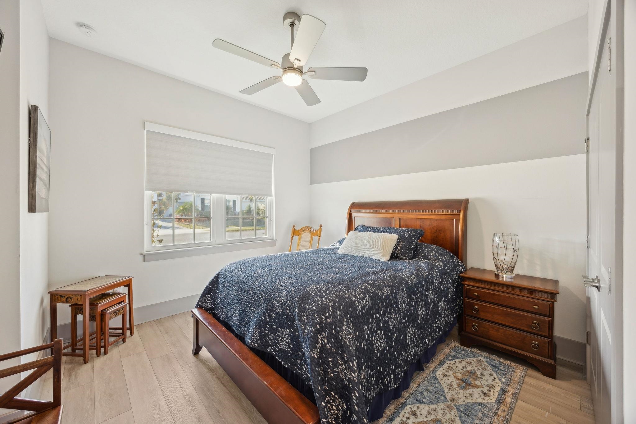 18 Rio Vista Drive Palm Coast, FL 32137 - Photo 43 of 73 a bedroom with a bed chandelier and a window