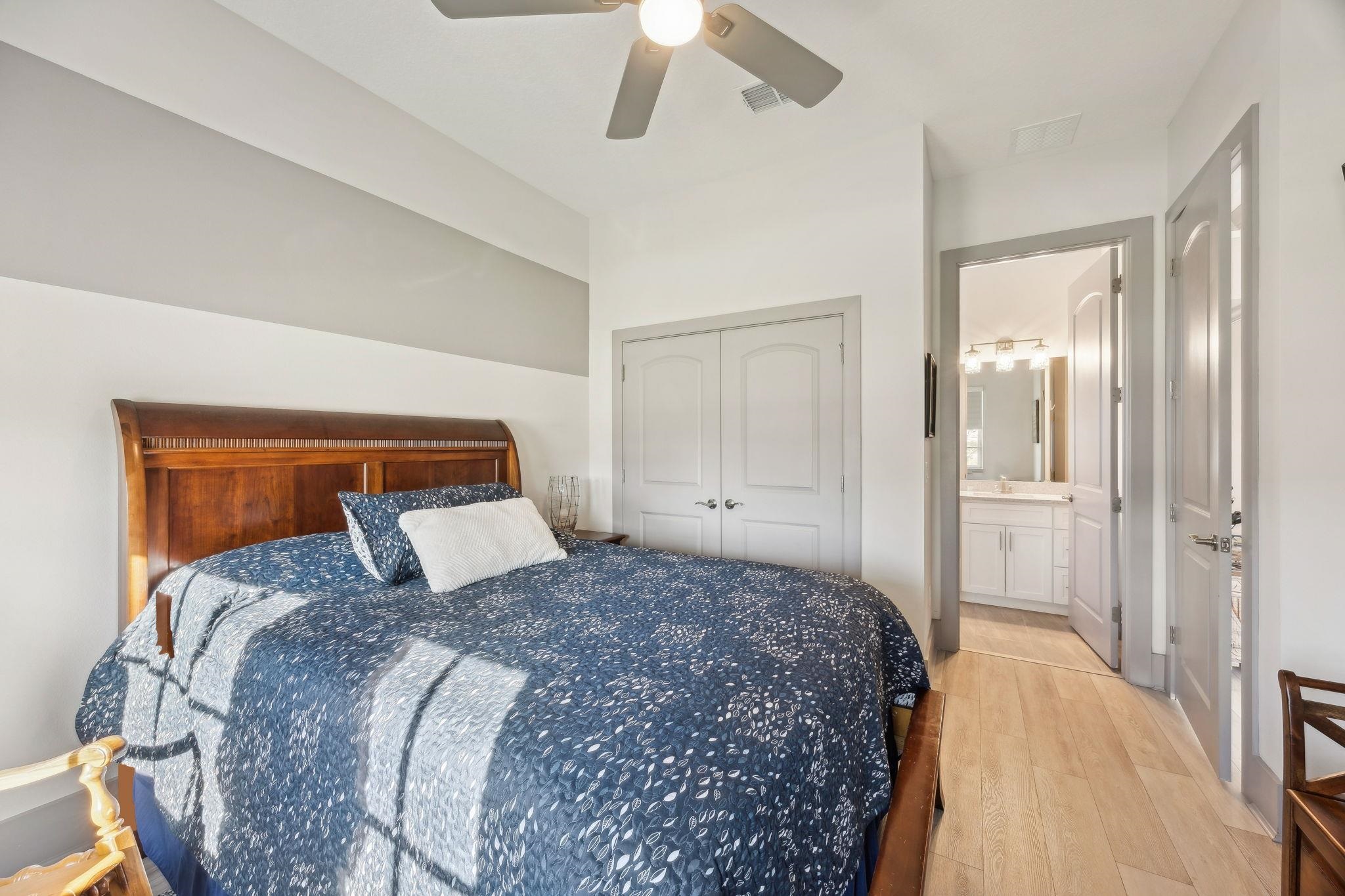 18 Rio Vista Drive Palm Coast, FL 32137 - Photo 44 of 73 a bedroom with a large bed and a chandelier