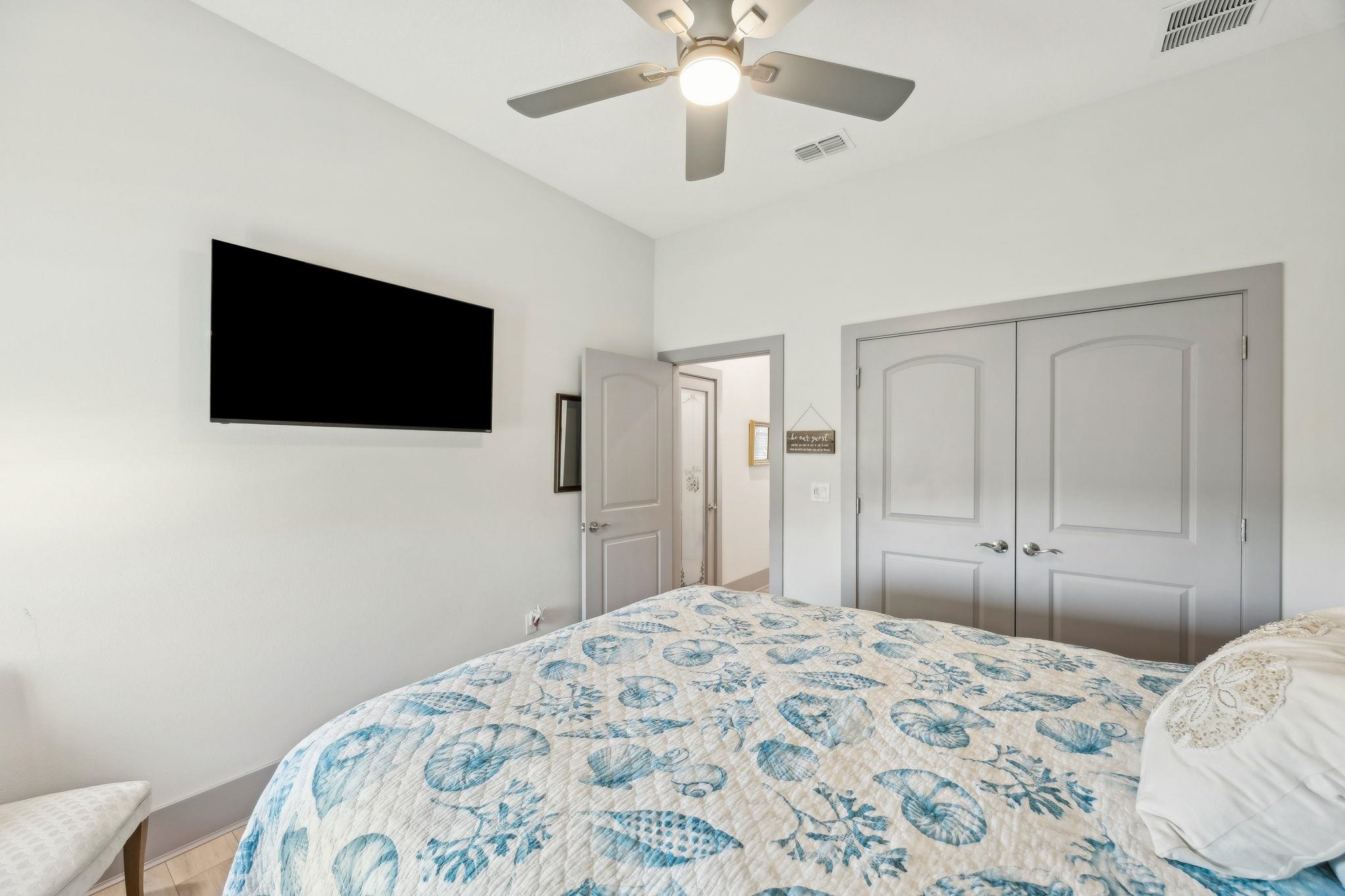 18 Rio Vista Drive Palm Coast, FL 32137 - Photo 48 of 73 a bedroom with a bed and a flat screen tv