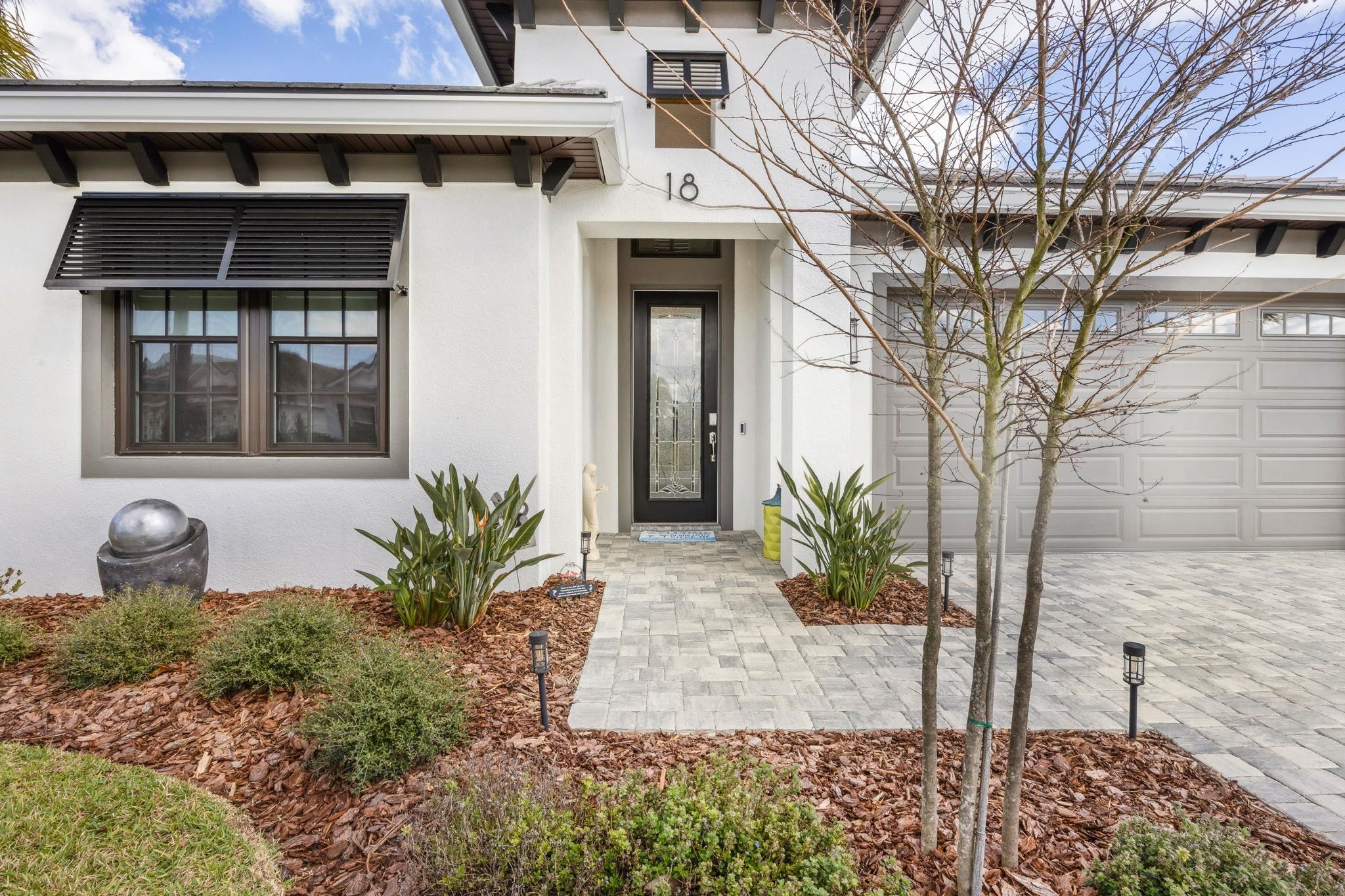 18 Rio Vista Drive Palm Coast, FL 32137 - Photo 5 of 73 a front view of a house with garden