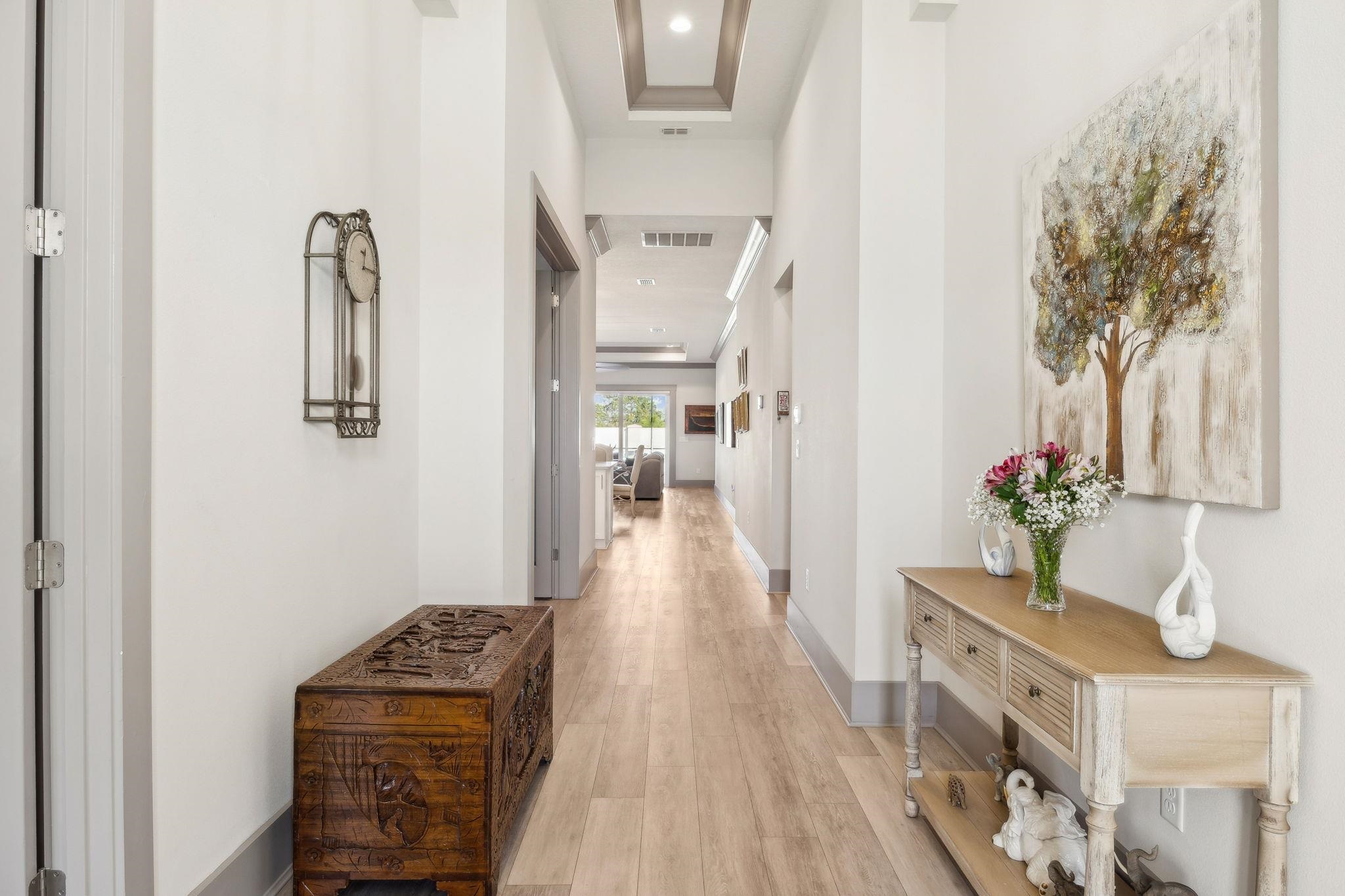 18 Rio Vista Drive Palm Coast, FL 32137 - Photo 7 of 73 Corridor with light wood finished floors, a high ceiling, and recessed lighting