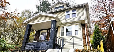 a front view of a house with a balcony