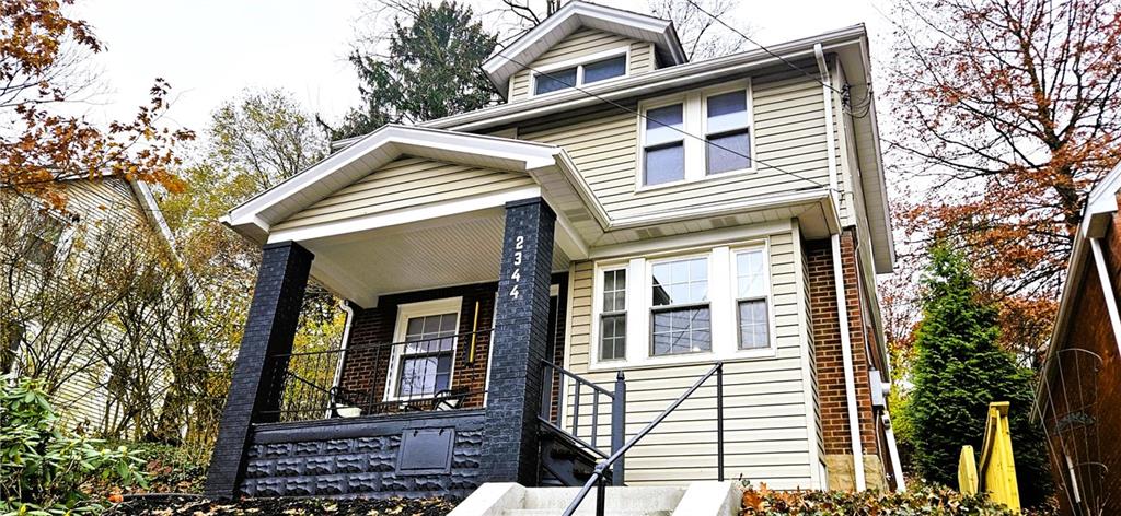 a front view of a house with a balcony