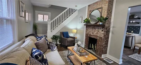 a living room with furniture and window