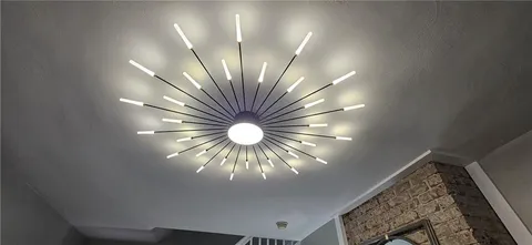 a bathroom with a glass shower door and a wooden door