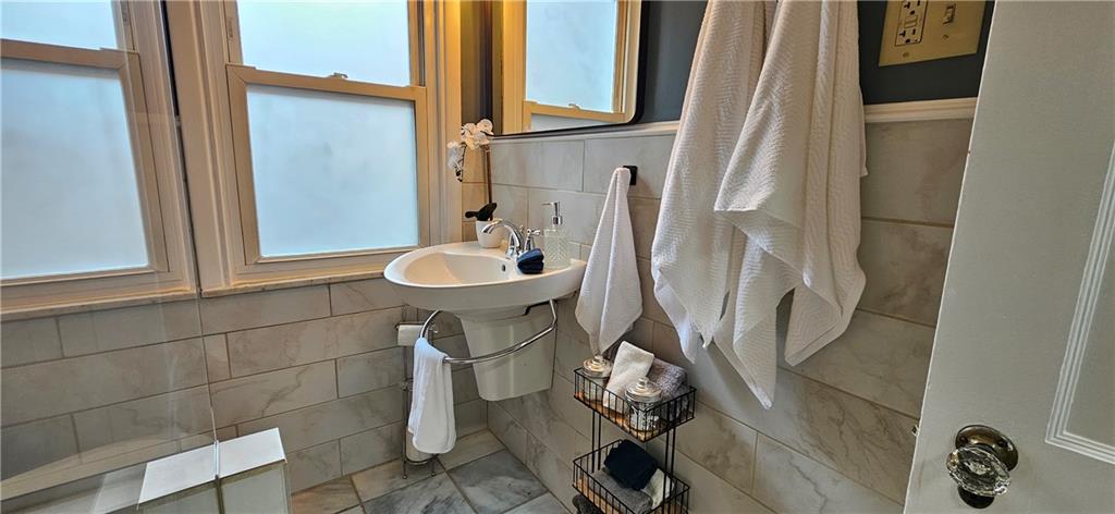 2344 Saranac Avenue Pittsburgh, PA 15216 - Photo 23 of 48 a bathroom with a toilet sink and mirror