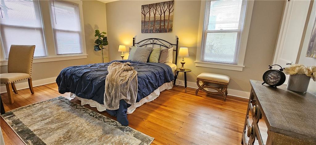 2344 Saranac Avenue Pittsburgh, PA 15216 - Photo 26 of 48 a bedroom with a bed and dresser with wooden floor