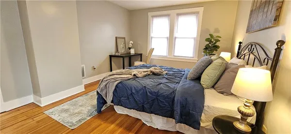 a view of a livingroom with furniture and a window