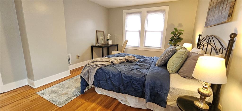 2344 Saranac Avenue Pittsburgh, PA 15216 - Photo 29 of 48 a bed sitting in a bedroom next to a window