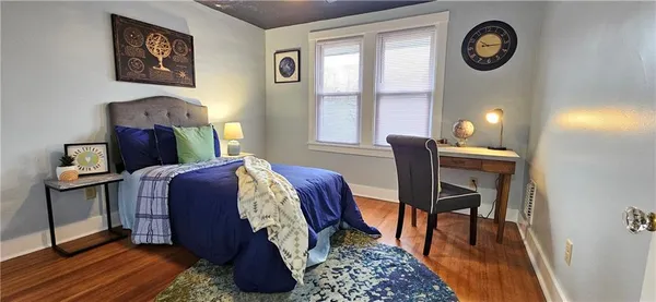a bedroom with furniture and a window