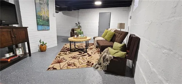 a bathroom with double vanity and a bathtub