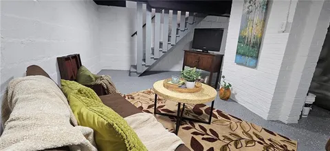 a view of house with outdoor seating space