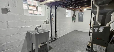 a backyard of a house with table and chairs