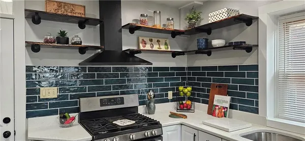 a kitchen with a cabinets and window