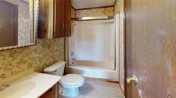 a bathroom with a shower and a toilet