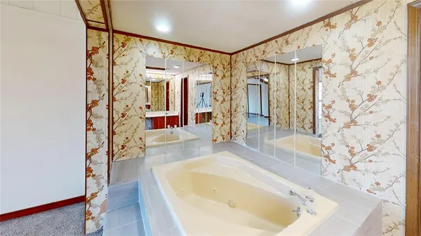 a bathroom with a bathtub and shower