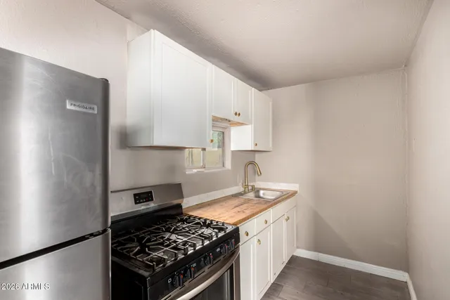 a kitchen with a stove and a refrigerator