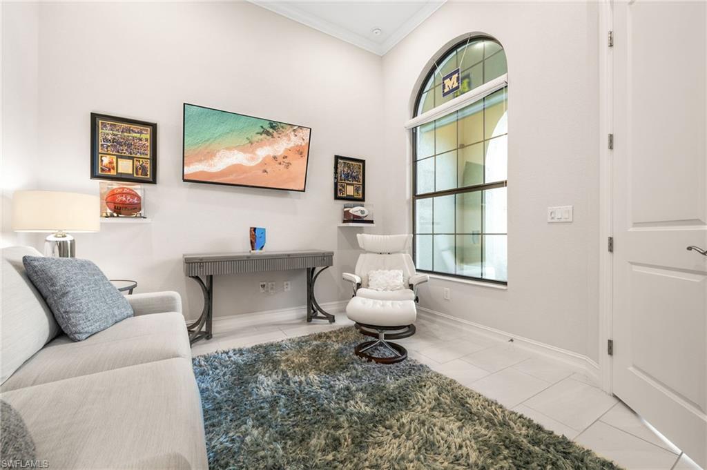 6608 Roma Way Naples, FL 34113 - Photo 11 of 50 Sitting room with light tile patterned flooring and crown molding