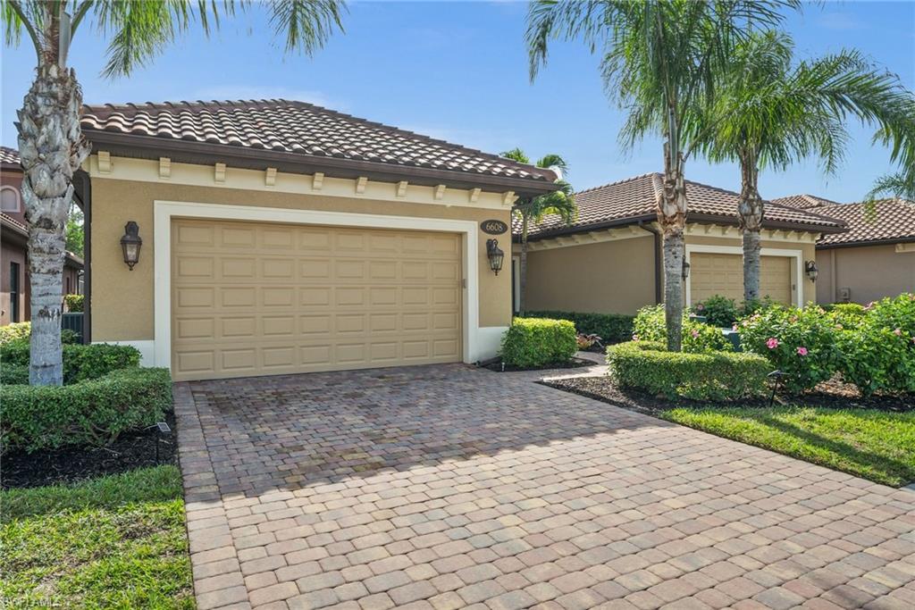 6608 Roma Way Naples, FL 34113 - Photo 2 of 50 Mediterranean / spanish-style house with a garage