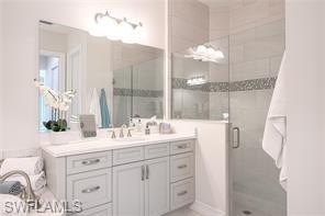 6608 Roma Way Naples, FL 34113 - Photo 24 of 50 Bathroom with a shower with shower door and vanity